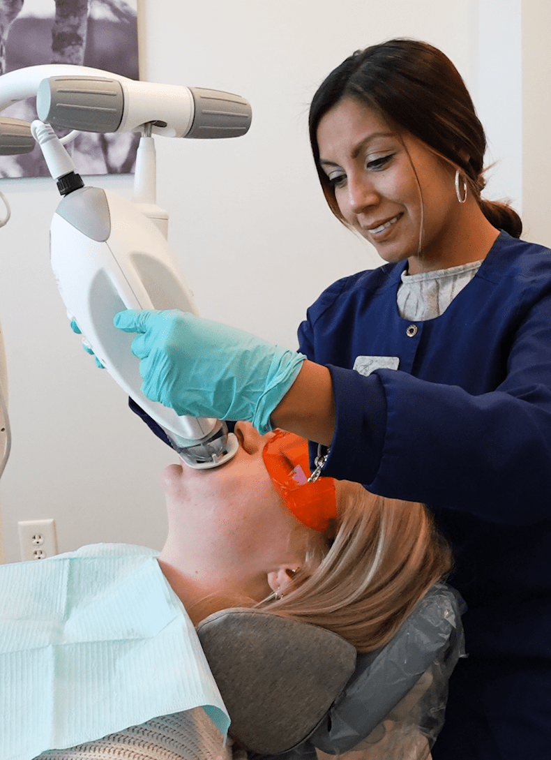 4 (1) Patient sitting in dental chair touching touch screen of x-ray image